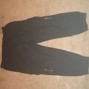 Black cargo pants with drawstrings.